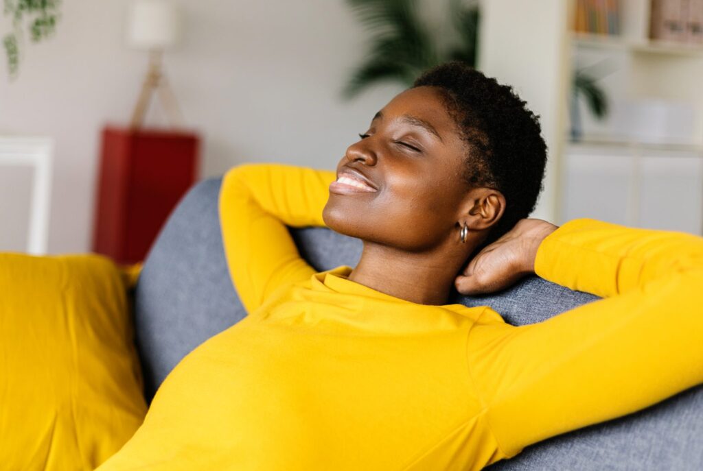 young-african-american-woman-relaxing-on-a-sofa